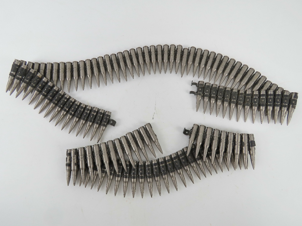 A large quantity of 7.62 drill rounds with link.