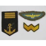 Three WWII Japanese cloth badges, including pilots, Navy and Army.