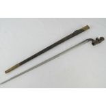 A Martini Henry bayonet with scabbard, dated 1884 bearing WD marker on blade and scabbard,