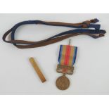 A WWII Japanese China incident campaign medal together with a WWII Japanese sword knot.