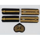 A WWII Japanese Navy Rank slides and badge.