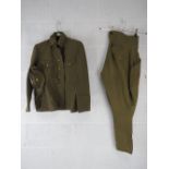 A WWII Japanese Army uniform comprising cap, trousers, and tunic with buttons.