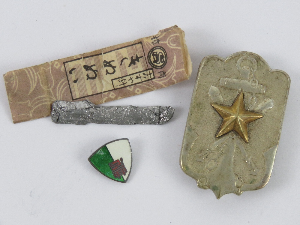 A WWII Japanese Time Expired Soldier's League Member's badge within box.