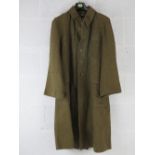 A WWII Japanese Army Great Coat with buttons, dated 1942 and bearing Japanese writing within.