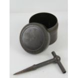 A WWII German bakelite fuse pot, together with a WWII German demolition screw.