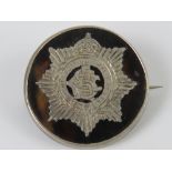 A WWI HM silver and tortoiseshell regimental sweetheart brooch having inlaid emblem for the Army