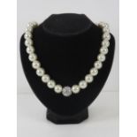 A Karen Millen faux pearl necklace in ba