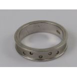 A silver band set with five diamonds, ring stamped 925, size P.