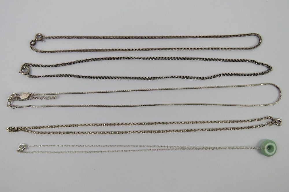 Four substantial silver chain necklaces,