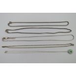 Four substantial silver chain necklaces,