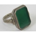 An Art Deco green onyx signet ring, unengraved, no apparent hallmarks, size U.