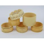 A set of four Victorian turned ivory napkin rings,