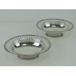 A pair of Victorian HM silver bonbon dishes having pierced decoration to rim and to single footed