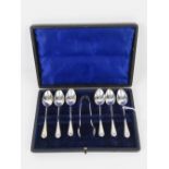 A cased set of HM silver teaspoons with associated sugar tongs, hallmarked Birmingham 1910,