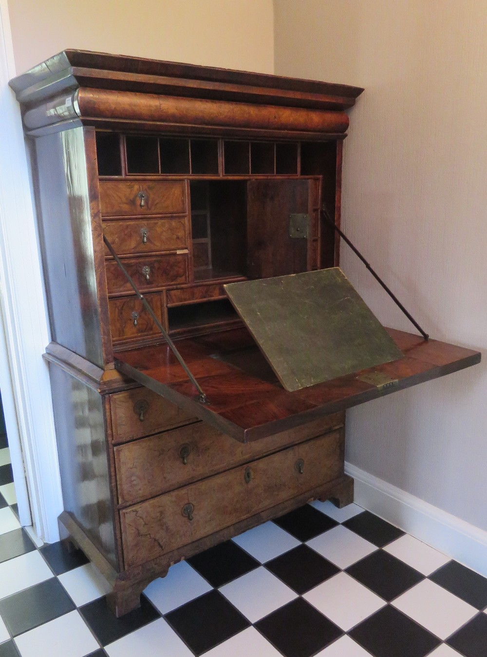 A superb walnut secretaire on chest having fine quality walnut cross banded fall front opening to