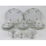 A part tea set, cream ground with transfer printed floral decoration comprising two cake plates,