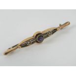A 9ct gold amethyst and seed pearl bar brooch, stamped 9ct, 5.4cm wide, 1.7g.