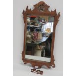 An early 19thC walnut framed wall mirror, pierced and carved throughout, a/f, 75 x 40cm.