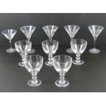 A quantity of five (four +one) cocktail glasses together with five sundae dishes.