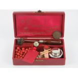 A vintage 'Georgian sealing set' inc wax beads, seal, pourer etc, all within leatherette box.