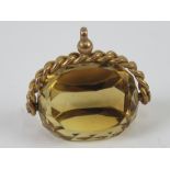 A large citrine spinning fob or pendant, warn marks (9c?), 3.4cm wide.