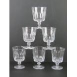 A quantity of six large glass footed tumblers.