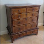 A fine walnut and oak chest on stand being two short over three long drawers to the upper section,