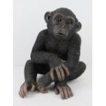 A resin figurine of a young chimp, 30cm high.