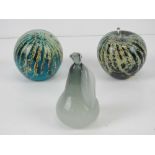 A pair of Mdina Maltese glass paperweights together with another small paperweight in the form of
