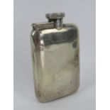 An HM silver hip flask having hinged screw cap lid, hallmarked London 1940,