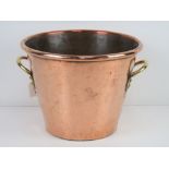 A fine copper jardiniere planter having brass side handles, 30cm dia, 22cm high.