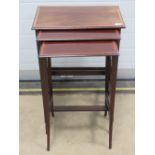 A good Edwardian nest of three mahogany tables each crossbanded with walnut and raised over slender
