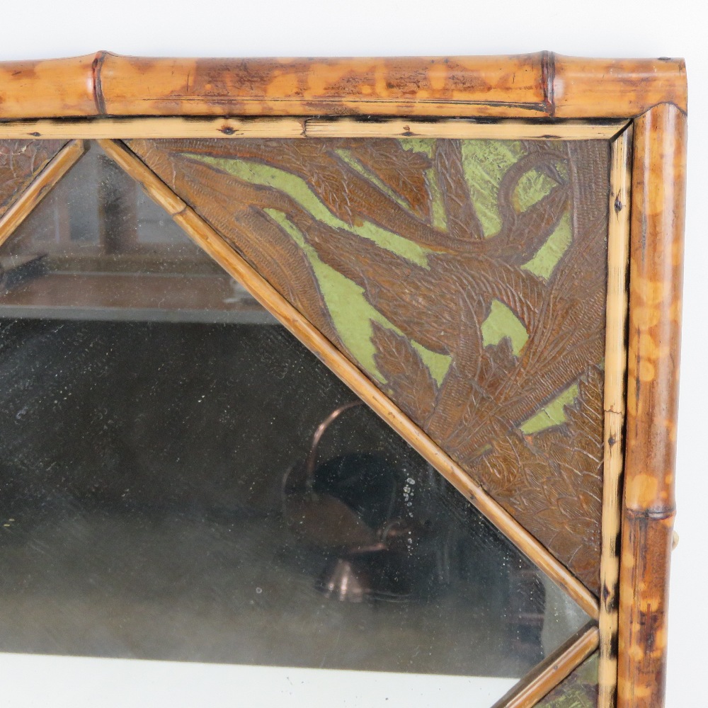 A late 19thC English Aesthetic Movement bamboo and embossed leather framed mirror, - Image 2 of 3
