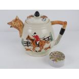 A hunting-themed teapot having fox head spout with huntsman on horseback decoration upon,