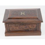 A decorative mahogany lidded box having blind carving and inset bone to top,