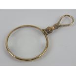 A Victorian gilt metal chatelain magnifying glass, 8.5cm in length.