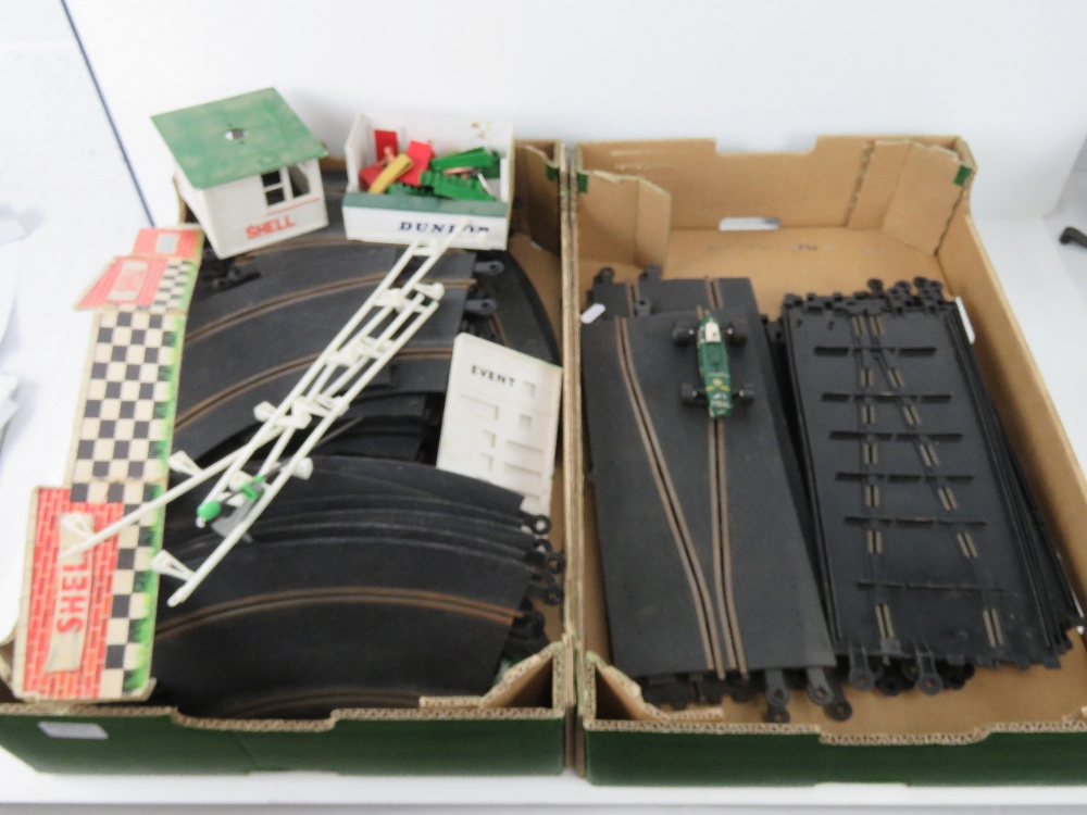 A quantity of vintage Triang Scalextric track and trackside ephemera.