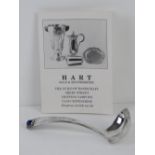 A Hart Gold & Silversmiths HM silver short ladle having blue cabachon to handle,