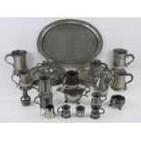 A large quantity of assorted 19th century and later pewter including; flagons, peppers,