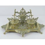 A pierced brass standish desk tray, liners deficient, 32cm wide.