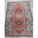 A teal and orange ground woollen rug having geometric design upon and measuring 185 x 130cm.