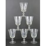 A quantity of six matching engraved wine glasses.