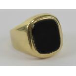 A 14ct gold signet ring set with unengraved onyx, stamped 585, size R, 6.5g.