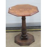 A good octagonal occasional side table in oak raised over gun barrel stem, 50 x 50 x 64cm.