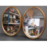 A good contemporary pair of oval wall mirrors, 77 x 55cm.