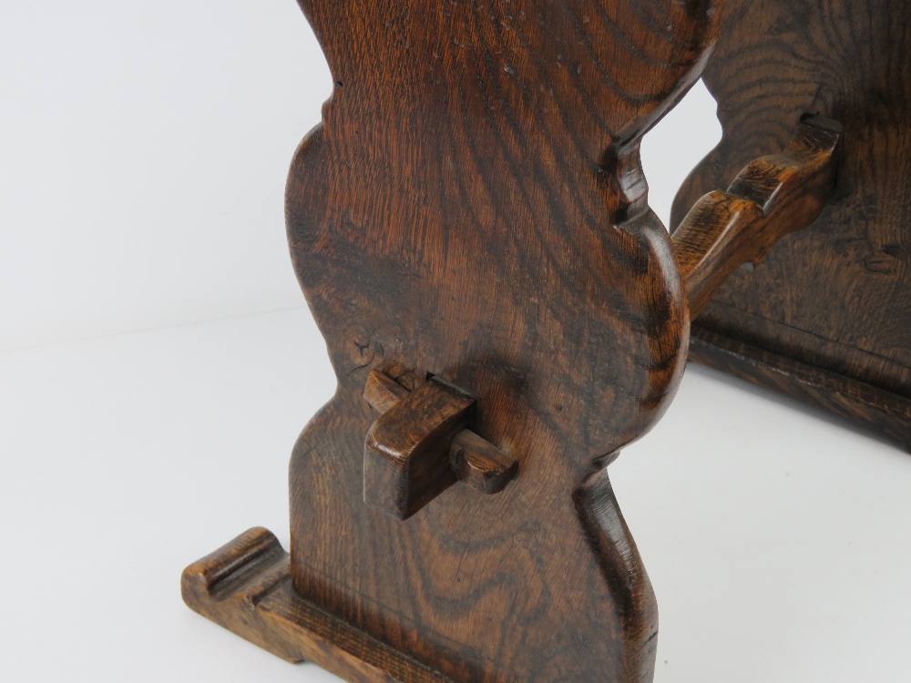 An early 20th century joint stool in oak, plank top and supports united by shaped trestle stretcher, - Image 3 of 3