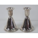 A pair of silver Christophersen short candlesticks,