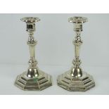 A pair of silver plated Georgian style octagonal candlesticks, each with removable drip tray,