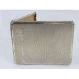 An HM silver Art Deco cigarette case having geometric design to front,