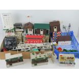 A quantity of assorted Triang Scalextric track and trackside buildings, some in original boxes,